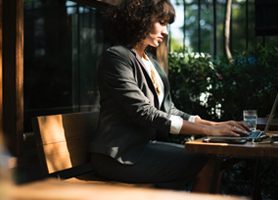 woman sitting at white desk